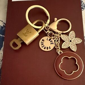 Louis Vuitton lock and key #342 Gold and with Floral bag Charm unbranded